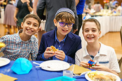 Children eating together. Links to Gifts That Protect Your Assets