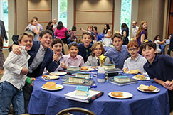 Students at a banquet. Links to Gifts of Appreciated Securities