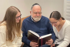 Abby, grade 11, and Eliana, grade 6, learn Daf Yom with their Zayde.